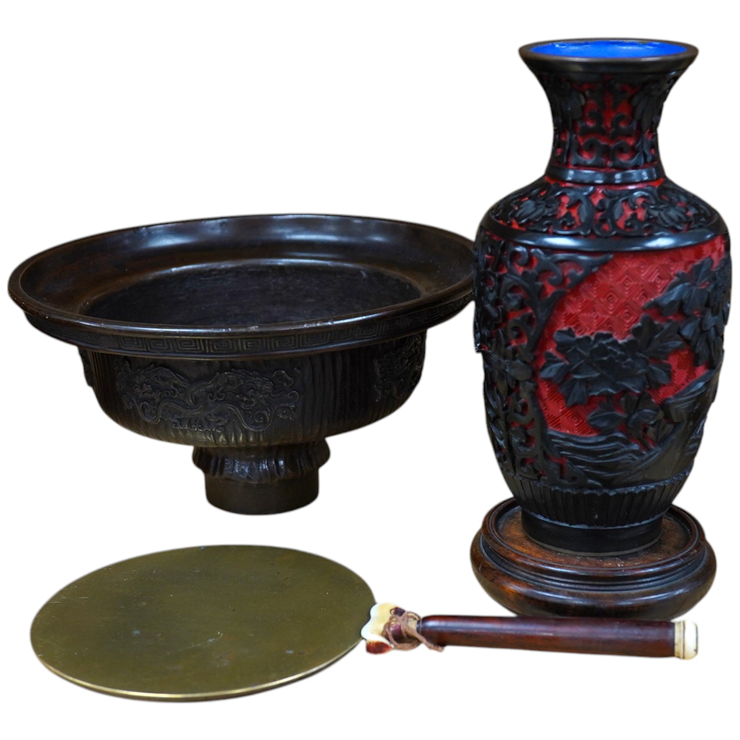 A Chinese bronze bowl, 17cm diameter, a lacquer vase, 15cm high, and a Chinese hand mirror with ivory inlay (3). CITES Submission reference 1UK5HNLM. Condition - fair to good